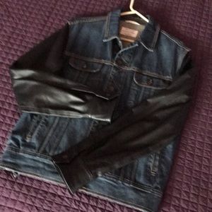 Denim jacket with leather sleeves